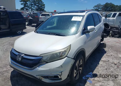 2015 Honda Cr-V Touring z USA, uszkodzony, nr VIN 5J6RM3H96FL023865